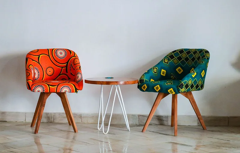 Accent chairs and side table showing confident use of texture and color