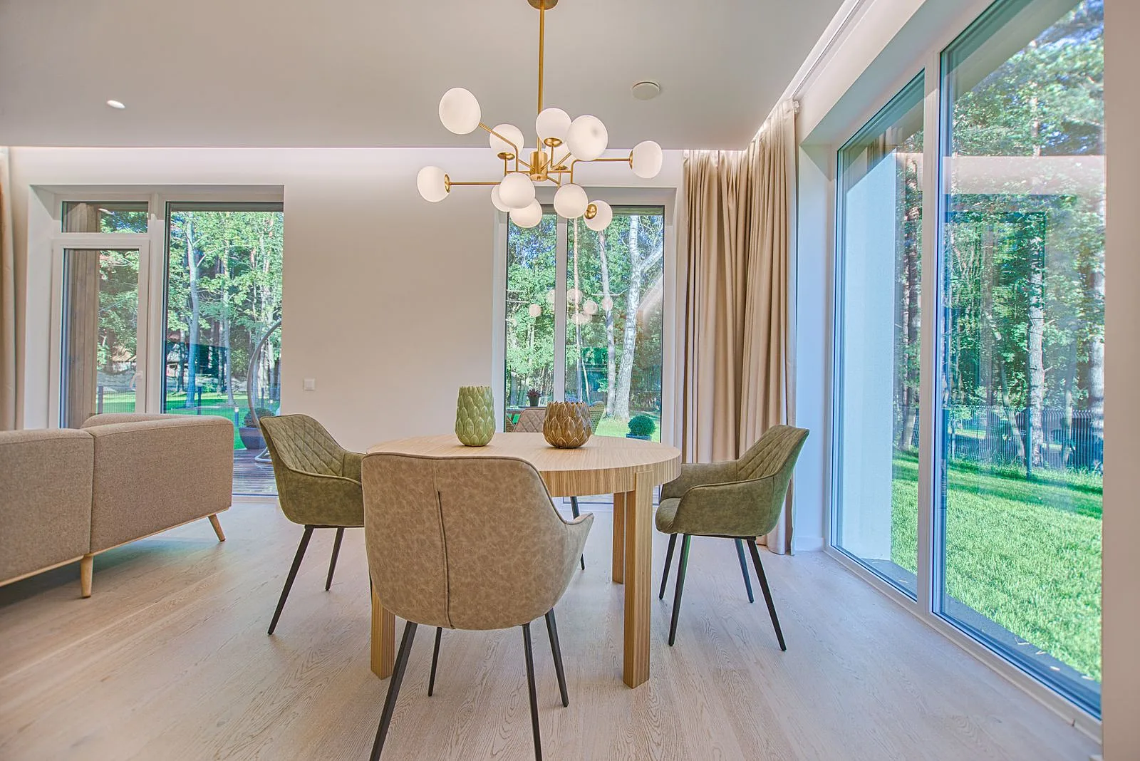 Bright dining area with upholstered seating and generous natural light