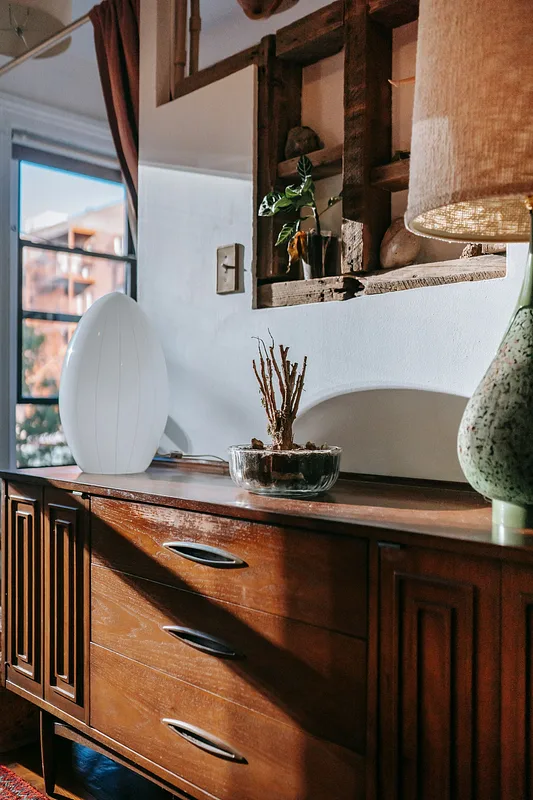 Styled vignette with natural light, texture, and warm materials